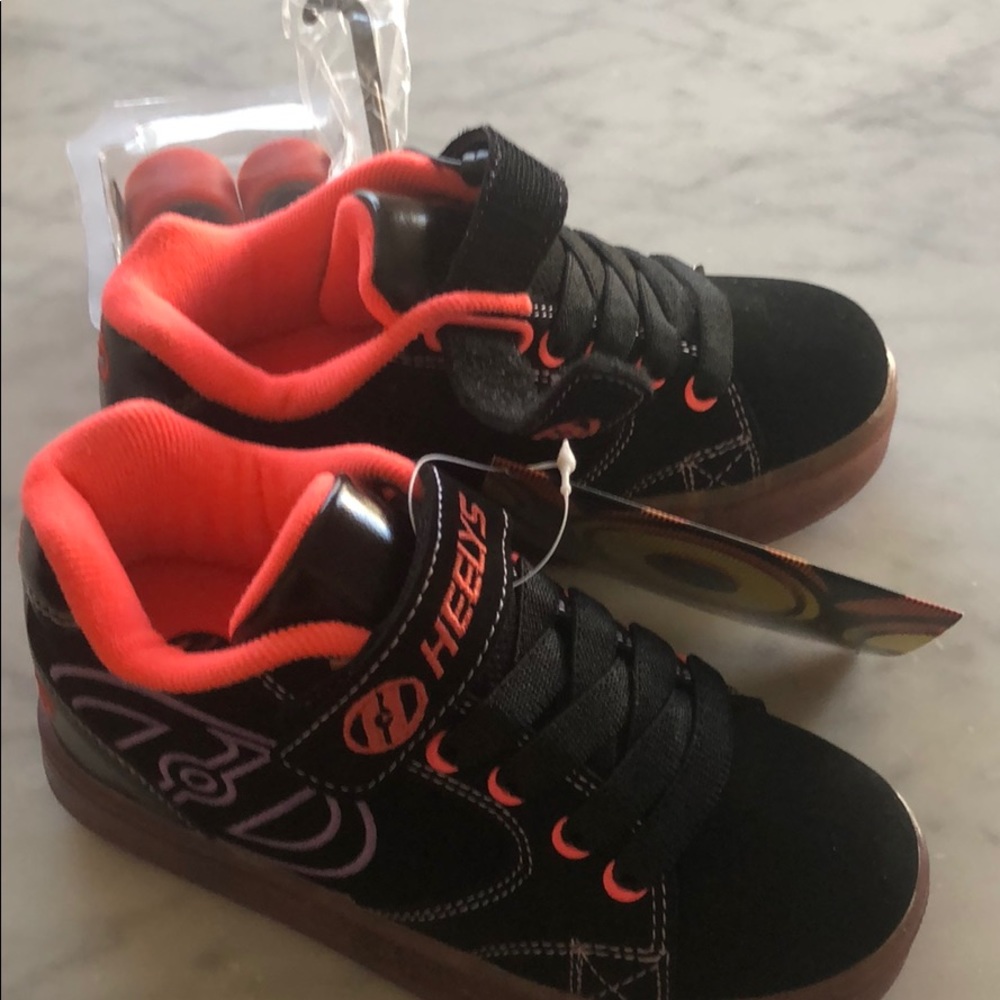 Heelys wheeled shoes.